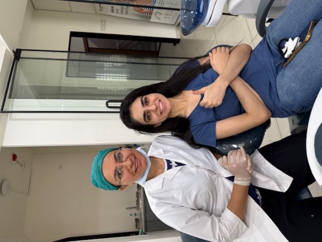 Smiling patient with doctor after treatment